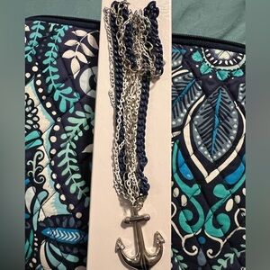 Set of anchor earrings, bracelet, and necklace.
